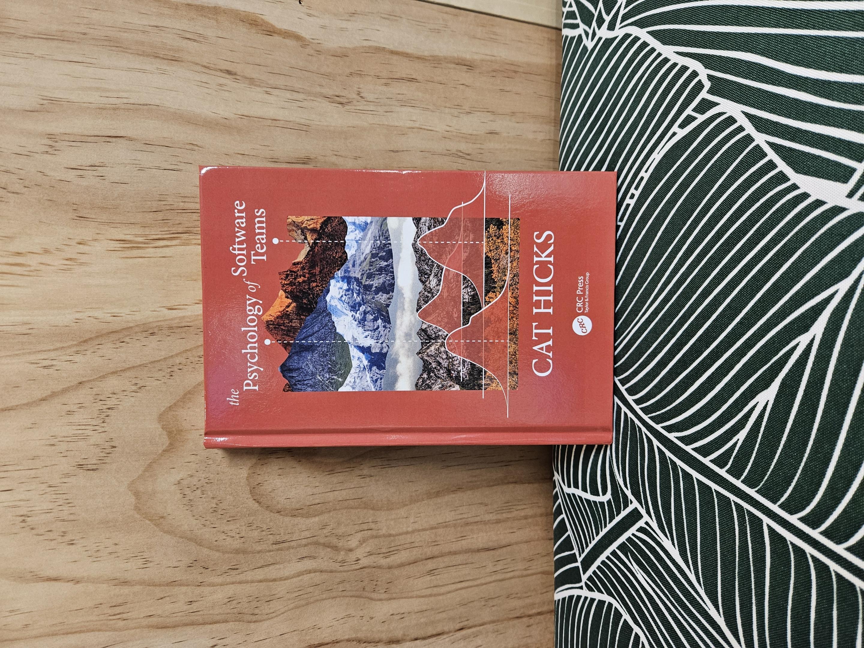 Hardcover copy of Dr. Cat Hicks' new book, The Psychology of Software Teams